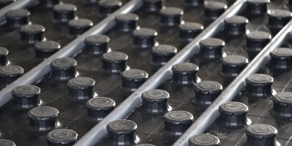 Close-up of a grid of circular heating elements, typical of an under-tank heating mat.